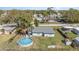 Aerial view of the backyard, lawn and above ground pool at 395 Bearcreek Dr, Bartow, FL 33830