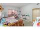 Bright bedroom with playful decor, storage cubbies, and a cozy bed, creating a cheerful space at 395 Bearcreek Dr, Bartow, FL 33830