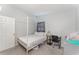 Simple bedroom showcasing a canopy bed, study desk, and minimalist decor, perfect for a peaceful retreat at 395 Bearcreek Dr, Bartow, FL 33830