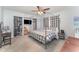 Bright bedroom featuring neutral paint, carpet and a bed with a black four poster bed at 395 Bearcreek Dr, Bartow, FL 33830