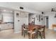 Open dining area featuring a large table, seating for four, and a bright connection to the kitchen at 395 Bearcreek Dr, Bartow, FL 33830