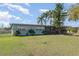 Cozy single-Gathering house featuring a screened-in porch and well-maintained front yard at 395 Bearcreek Dr, Bartow, FL 33830