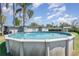 Backyard view of the above-ground pool at 395 Bearcreek Dr, Bartow, FL 33830