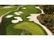 Scenic aerial view of golf course highlighting the manicured greens, sand traps and a winding cart path at 432 Ocean Course Ave, Davenport, FL 33896