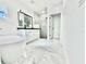 Bathroom featuring a double sink vanity, a mirror, soaking tub, and a glass-enclosed shower with modern fixtures at 4501 Dallas Blvd, Orlando, FL 32833