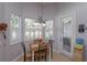 Bright breakfast nook with shuttered windows and table for four at 4963 Rock Rose Loop, Sanford, FL 32771