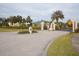 Beautiful entrance to the community with manicured landscaping and ornate pillars at 4963 Rock Rose Loop, Sanford, FL 32771