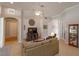 Comfortable living room featuring a ceiling fan, neutral decor, and tile floors at 4963 Rock Rose Loop, Sanford, FL 32771