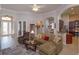 Living room with tile flooring, cozy seating, and lots of natural light at 4963 Rock Rose Loop, Sanford, FL 32771