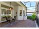 Outdoor patio area with brick pavers, a ceiling fan, and comfortable seating for relaxation at 4963 Rock Rose Loop, Sanford, FL 32771