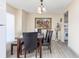 Dining area with modern flooring, chandelier, and stylish decor at 5042 Downing St # 5, Orlando, FL 32839