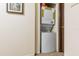 Hallway features stackable washer and dryer at 5042 Downing St # 5, Orlando, FL 32839