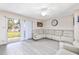 Bright living room featuring modern flooring and sliding glass doors to outdoors at 5042 Downing St # 5, Orlando, FL 32839