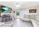 Bright living room featuring modern flooring and sliding glass doors to outdoors at 5042 Downing St # 5, Orlando, FL 32839