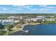 Panoramic view of a lakeside community with a gazebo and city skyline in the distance at 5189 Fenwood Ln, Orlando, FL 32814