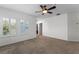 Bedroom featuring plush carpet, ceiling fan, and natural light at 5189 Fenwood Ln, Orlando, FL 32814