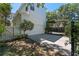 A detached two-car garage with a paved driveway and verdant landscaping at 5189 Fenwood Ln, Orlando, FL 32814