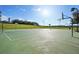 A well-maintained outdoor basketball court offers opportunities for recreation and community engagement on a sunny day at 5269 Red Coral Cir, Mount Dora, FL 32757