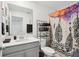 Bathroom featuring a vanity with solid surface counter and patterned shower curtain at 5269 Red Coral Cir, Mount Dora, FL 32757