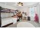bedroom with bunk beds, a vanity, a round rug, and plush decor at 5269 Red Coral Cir, Mount Dora, FL 32757