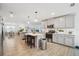 Bright kitchen featuring an island, stainless steel appliances, and open access to a dining room at 5269 Red Coral Cir, Mount Dora, FL 32757