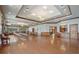 Large meeting room with hardwood floors, wood trim, and large windows for lots of natural light at 5269 Red Coral Cir, Mount Dora, FL 32757