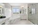 Bright bathroom featuring marble accent wall and a glass enclosed shower with a window at 5314 Adair Oak Dr, Orlando, FL 32829