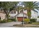 Charming two-story home with lush landscaping and a two-car garage at 5314 Adair Oak Dr, Orlando, FL 32829