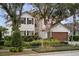 Charming two-story home with lush landscaping and a two-car garage at 5314 Adair Oak Dr, Orlando, FL 32829