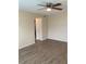 Bedroom with ceiling fan, laminate floors, and neutral paint at 5325 Curry Ford Rd # B201, Orlando, FL 32812