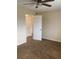 Bedroom showcasing neutral carpet, a ceiling fan, and a closet with sliding doors at 5325 Curry Ford Rd # B201, Orlando, FL 32812