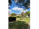 Well-maintained lawn and shrubs surround the exterior of this community with mature trees at 5325 Curry Ford Rd # B201, Orlando, FL 32812