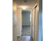 Hallway view with carpeted bedroom and closet at 5325 Curry Ford Rd # B201, Orlando, FL 32812