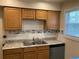 Kitchen featuring granite countertops, stainless steel appliances, and tile backsplash at 5325 Curry Ford Rd # B201, Orlando, FL 32812