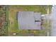 Aerial view of the property showcasing the roof, landscaping, and enclosed patio at 5477 Glen Oak Pl, Sanford, FL 32771