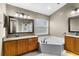 Bathroom boasts dual vanities, granite countertops, and a soaking tub at 5477 Glen Oak Pl, Sanford, FL 32771