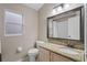 Bathroom with a large vanity, granite countertop and integrated sink at 5477 Glen Oak Pl, Sanford, FL 32771