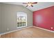 Bedroom with vaulted ceilings and large window letting in natural light at 5477 Glen Oak Pl, Sanford, FL 32771