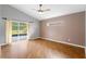 Bright bedroom with sliding glass doors and hardwood floors at 5477 Glen Oak Pl, Sanford, FL 32771