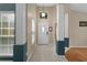 Bright foyer with tile flooring, decorative columns, and a view of the front door at 5477 Glen Oak Pl, Sanford, FL 32771