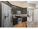 Kitchen area featuring stainless steel appliances and granite counters at 5477 Glen Oak Pl, Sanford, FL 32771