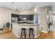 Kitchen with stainless steel appliances, granite countertops, and dark wood cabinetry at 5477 Glen Oak Pl, Sanford, FL 32771