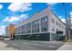 Street view of a modern gray building with large windows and visible street parking at 62 W Colonial Dr # 301, Orlando, FL 32801