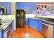 Modern kitchen featuring blue cabinets and stainless steel appliances at 62 W Colonial Dr # 301, Orlando, FL 32801