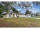 Well-maintained one-story home features a 2-car garage and driveway on a grass lot at 760 Mentmore Cir, Deltona, FL 32738