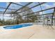 Lovely private screened pool with an outdoor seating area to enjoy the backyard at 760 Mentmore Cir, Deltona, FL 32738