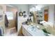 Stylish bathroom featuring a sleek single sink vanity and modern decor accents at 803 N Shore Dr, Leesburg, FL 34748