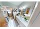 Tidy bathroom featuring a single sink vanity and a well-lit mirror at 803 N Shore Dr, Leesburg, FL 34748