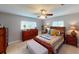 Cozy bedroom featuring a dresser, and natural light from two windows at 803 N Shore Dr, Leesburg, FL 34748