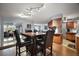 Open concept dining room features a dining table with seating for four and natural light at 803 N Shore Dr, Leesburg, FL 34748